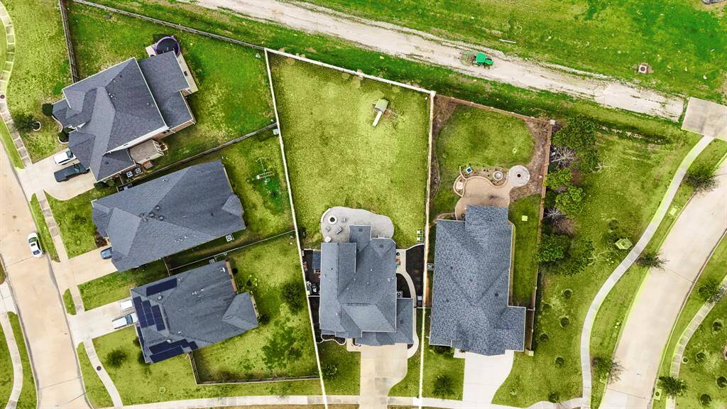 The aerial view showcases the oversized pool sized lot with no direct back neighbors. There's plenty of space to design your own backyard oasis!