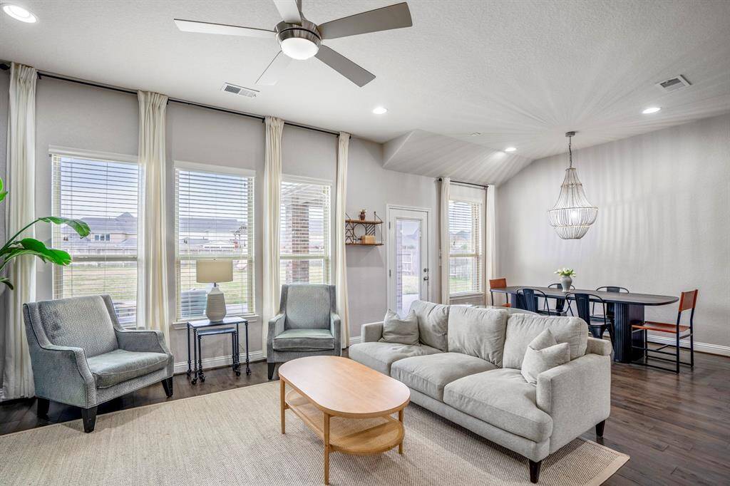 So much natural light and space! This light and bright spacious living room and dining area is the perfect layout for entertaining or just relaxing!