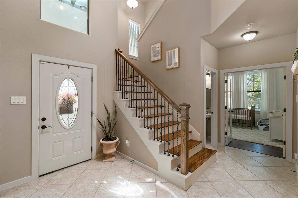 As you step inside, you are greeted by a spacious open floor plan that connects the living room and dining room creating an idea space for entertaining .
