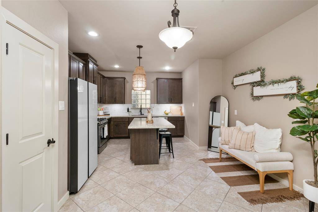 The kitchen is equipped with updated appliances, countertops and recent backsplash.