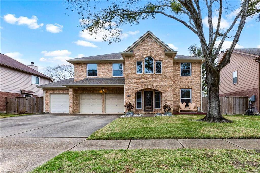 Seabrook beauty with 4 car garage... the third bay is tandem.