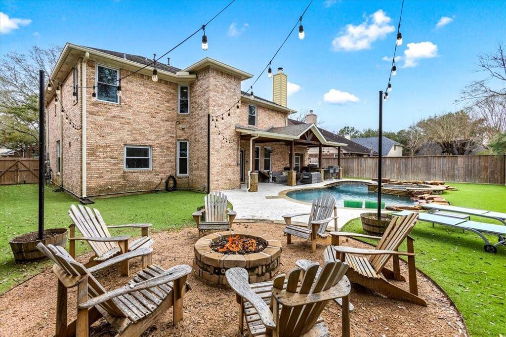 Fully turfed backyard with fire pit area