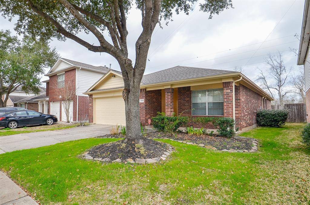 Charming single-story brick home with a two-car garage and well-maintained front yard. Featuring a mature tree in the front, the house offers a neat curb appeal in a suburban neighborhood.