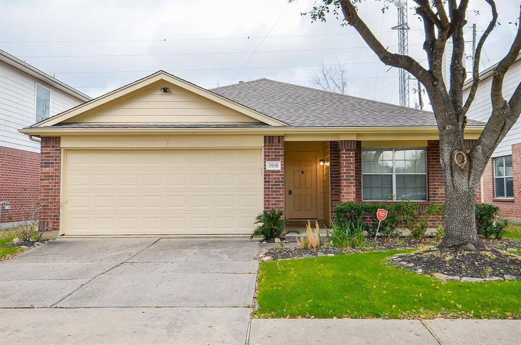Charming single-story home with a brick exterior and a two-car garage. The front yard features a well-maintained lawn and mature tree, offering great curb appeal. Ideal for those seeking a cozy and inviting residence.