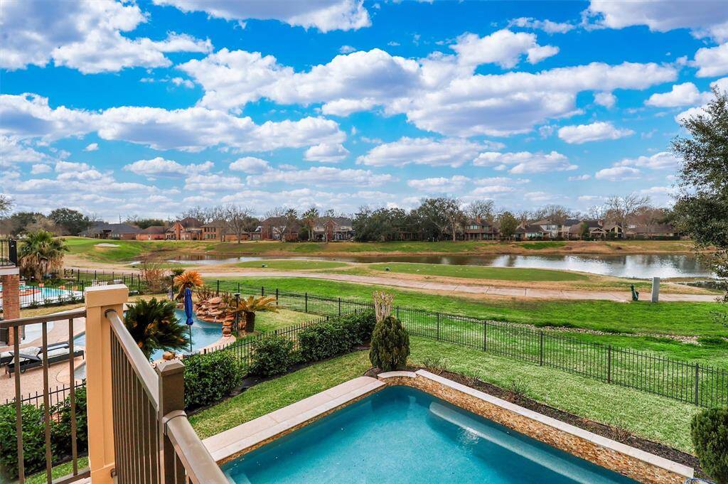 Enjoy the relaxing views of your backyard pool and water view golf course lot from the outside second floor balcony of this beautiful property!