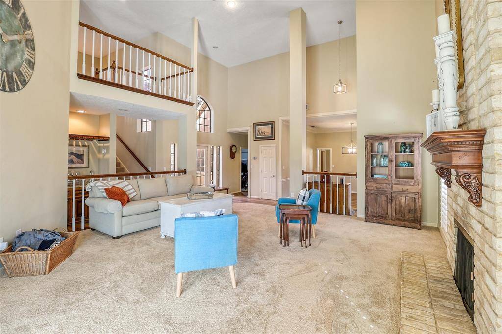Another view of soaring open family room, foyer, and dining room from upgraded sliding back door.