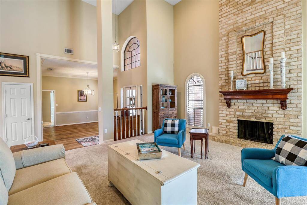 Another view of open family room, foyer, and dining room.