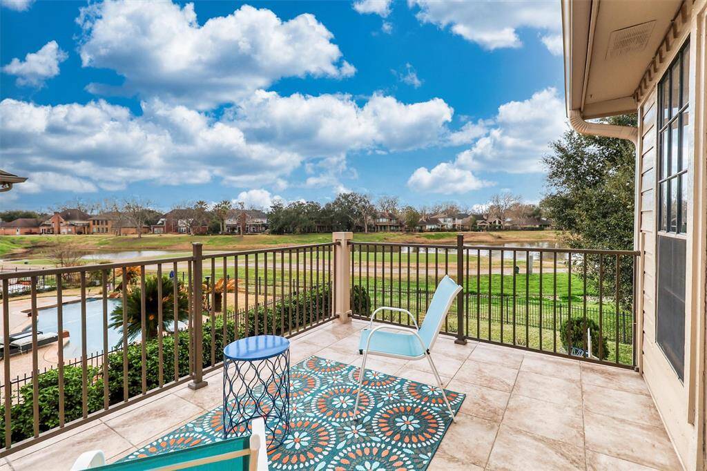 Gorgeous view from second floor outside balcony on this beautiful golf course water view lot.