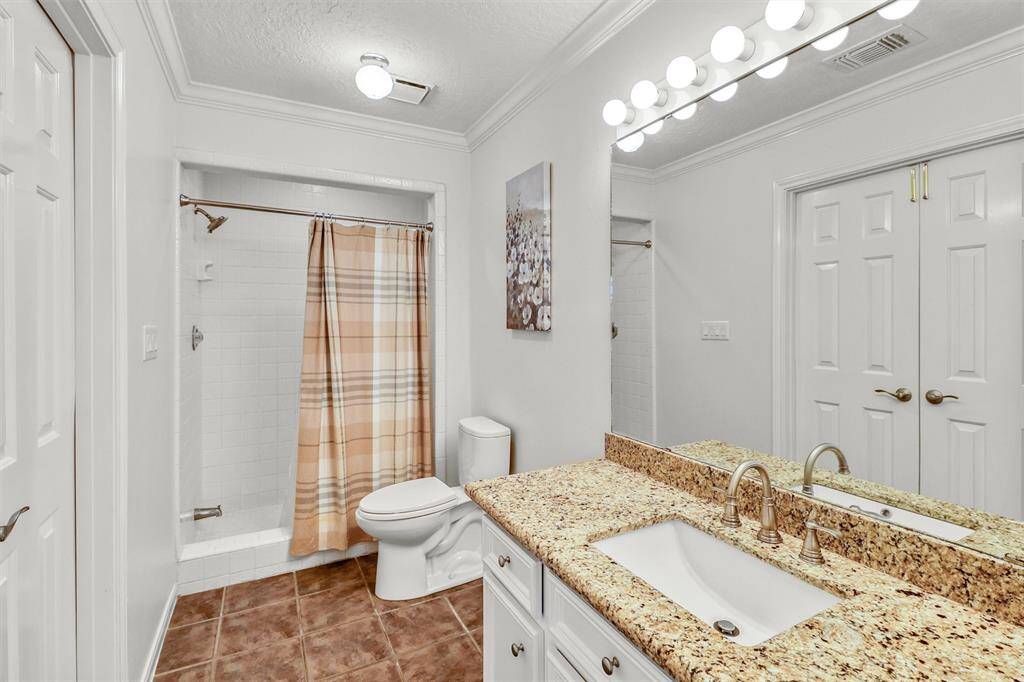 Large second floor full bathroom features step-in shower and granite counter.