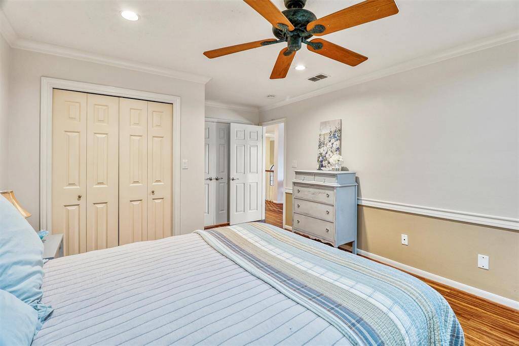 Another view of upstairs secondary bedroom looking towards doorway and features double door closet.