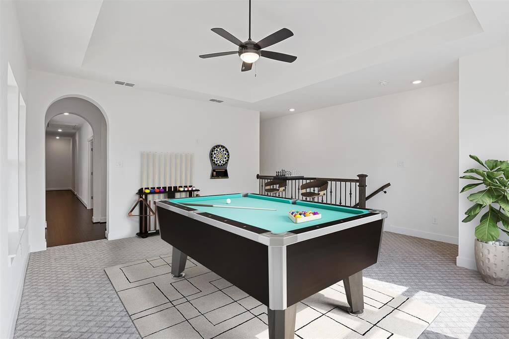 Experience endless entertainment in this virtually staged game room, perfect for family fun and relaxation.