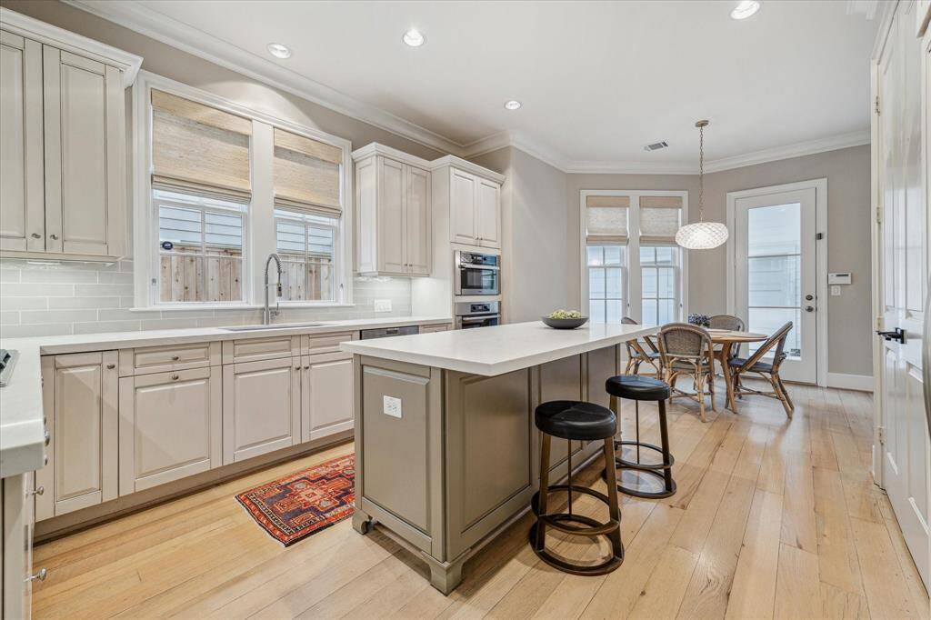 KITCHEN.   The owners thoughtfully updated the kitchen with a move away from all white to the more warm toned color palette favored by designers today.