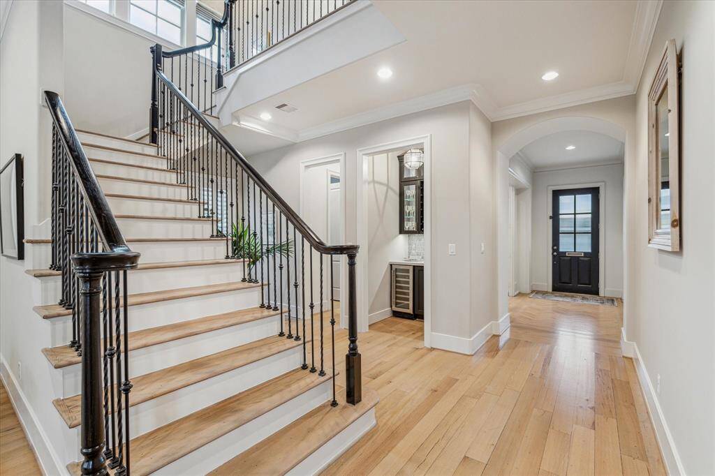 The stair well sits in the center of the home so forms a nice divide between the formal rooms at the front and the family room at the back.    Note the refinished hardwoods which flow throughout the first and second floors.