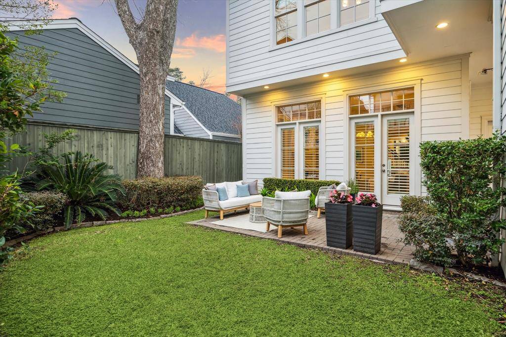 BACKYARD.   Perfect for those warm evenings and could accommodate seating as currently shown or have an outdoor dining table instead.