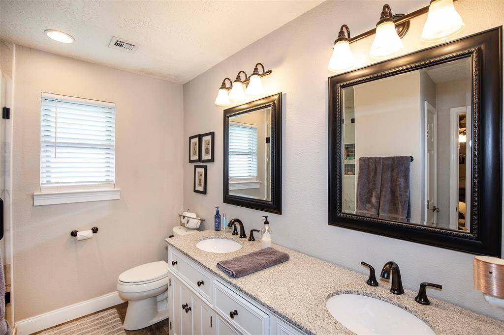 This bedroom includes ample natural lighting, ceiling fan with lighting and walk in closet.