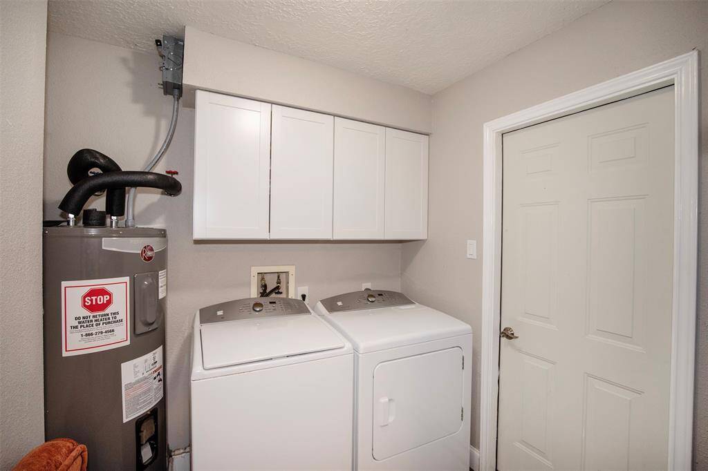 This room is a cozy space with neutral walls and carpeted flooring. It features a ceiling fan with lights includes a large walk in closet.