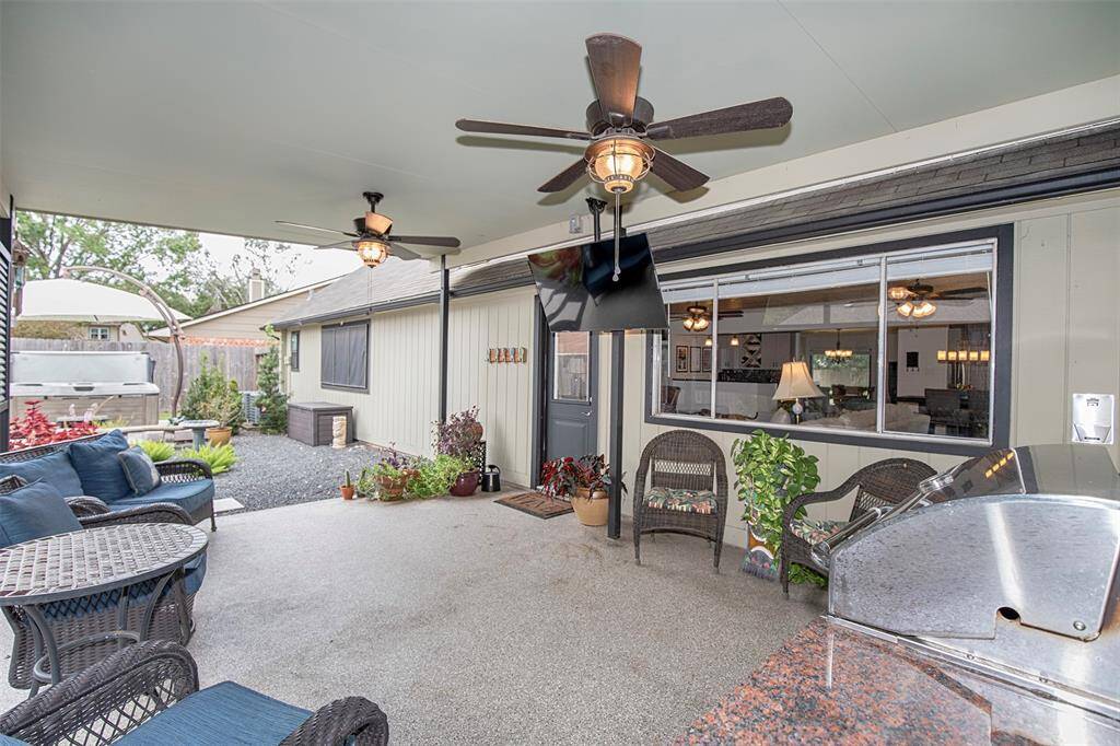 The primary bedroom features ample space for a king bed and large furniture, a ceiling fan, and hardwood flooring. The remodeled ensuite includes large tiled shower and plenty of closet space.