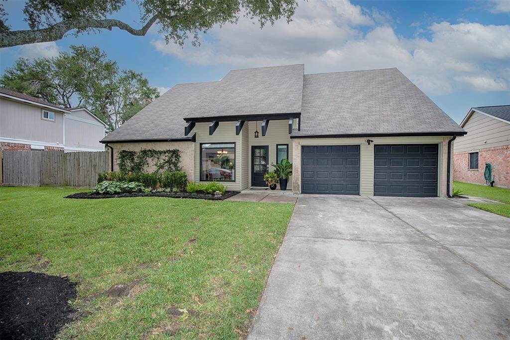 Charming two-story home with a modern exterior, featuring a spacious driveway and a two-car garage. The manicured lawn and tasteful landscaping enhance its curb appeal, while large windows offer ample natural light. Ideal for comfortable family living.