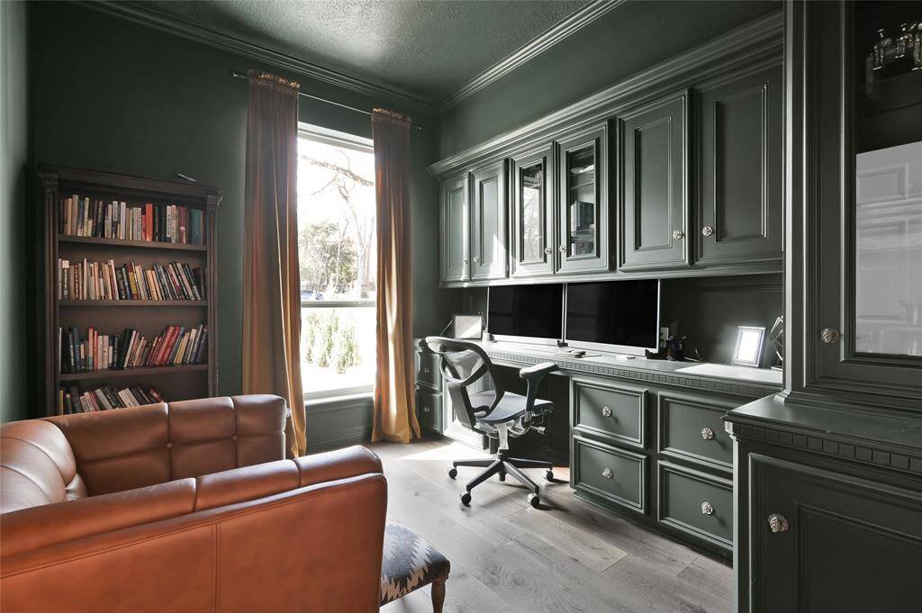 As you continue on the first floor leading towards the primary suite a dedicated office/study with built-in welcomes you to the primary side of the home.