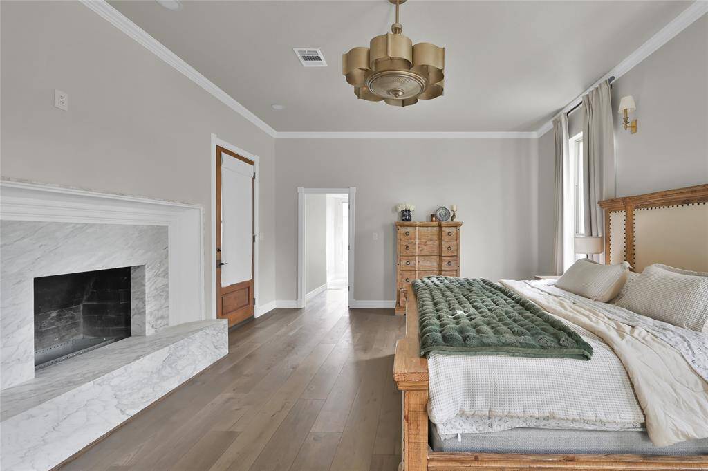 The wood burning fireplace adds elegance and function to the space. Step out of room onto the private patio overlooking 5+ stunning acres.