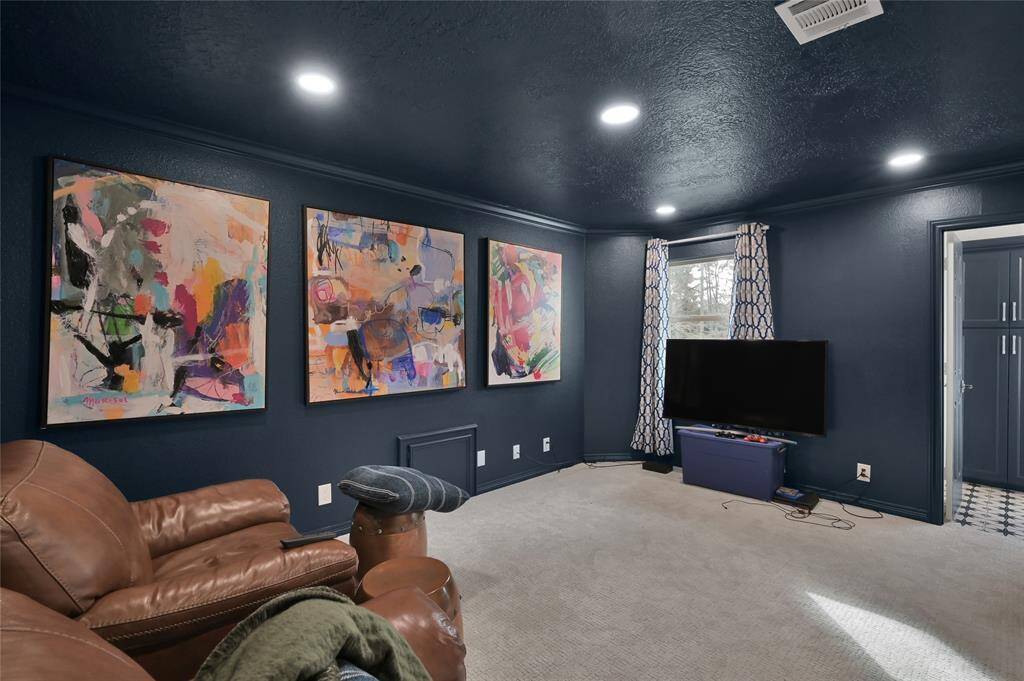 Movies or bowl season are ideal in this media room which could also be utilized as bedroom #5.