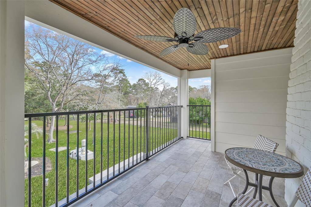 Another private balcony just off the media room upstairs with incredible views of the acerage.