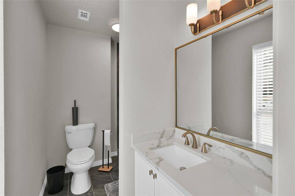 Secondary in-suite, completely updated bathroom with shower only on second floor.