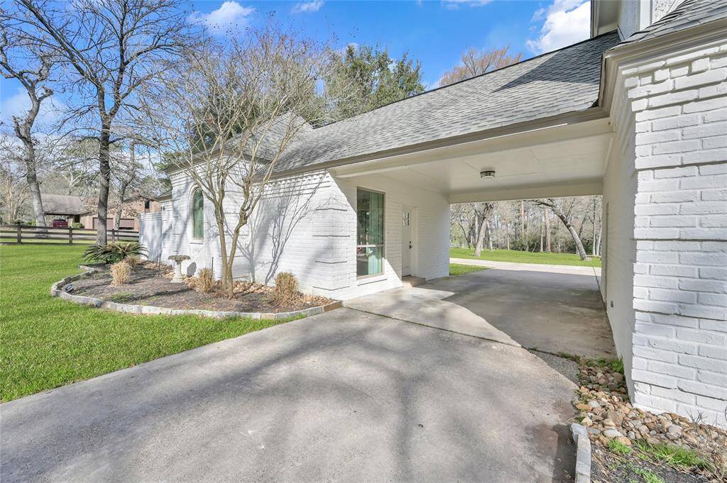 Step through the huge 3 car attached garage and through the porte-cochere and into the guest house.