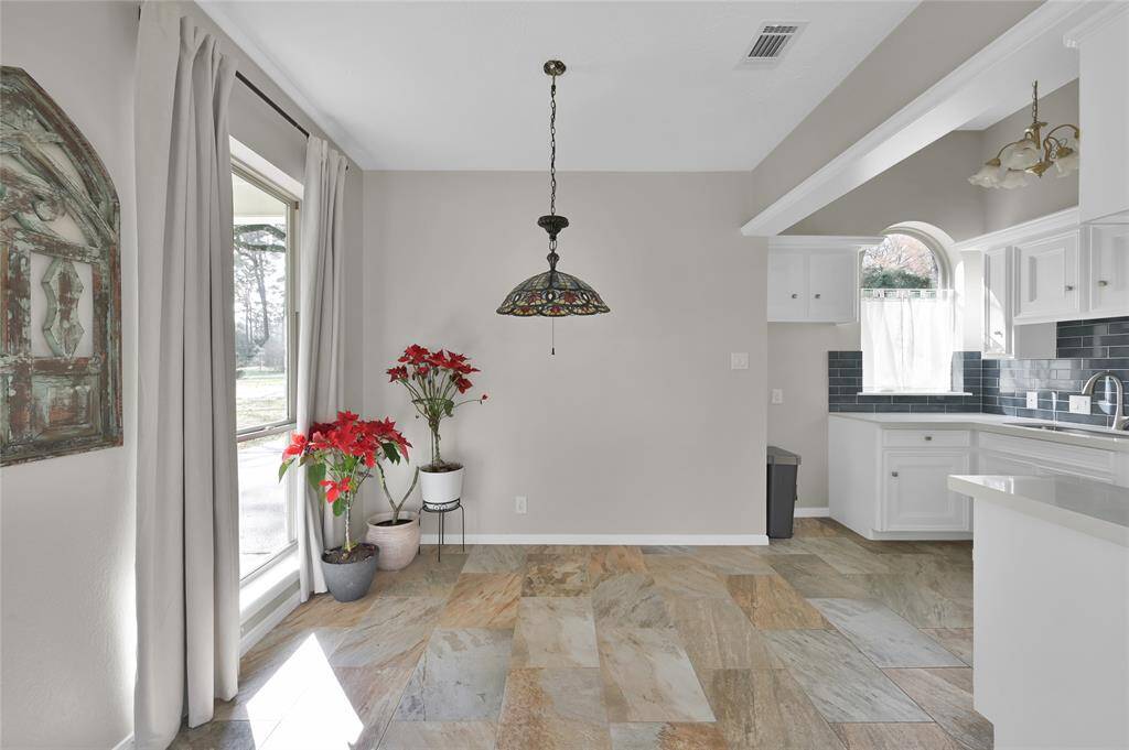 Small but open and well lit dining area right off the guest house kitchen.