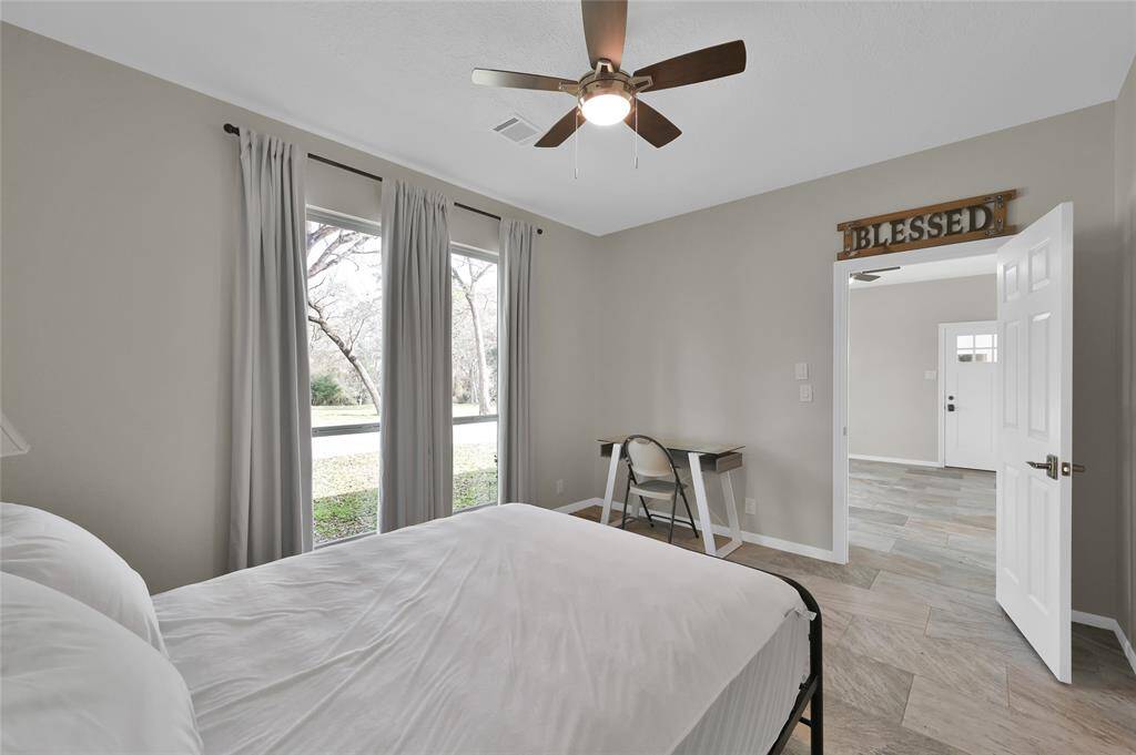 The bedroom of the guest house is large and has beautiful natural light.