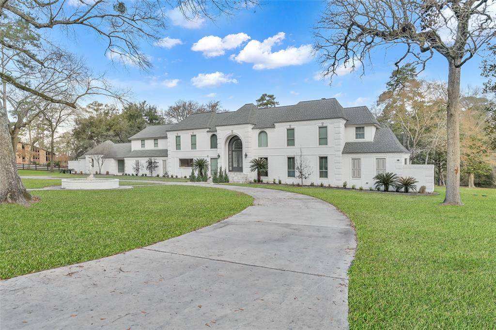 The large circle driveway welcomes you and your guests to this turnkey estate.
