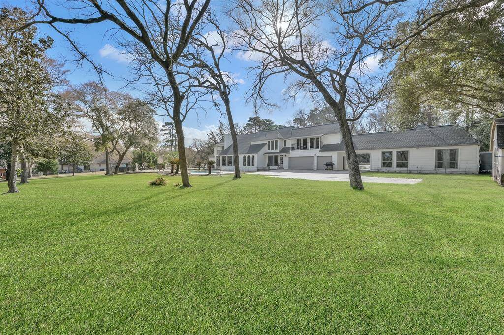 A view of the expanse of the cleared section of the back acreage. This is truly a kids delight with unlimited options on play and utility.