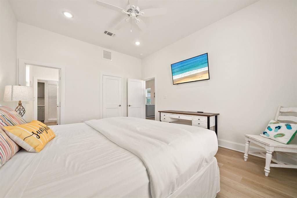 The primary bedroom exudes the quintessential feel of coastal charm!