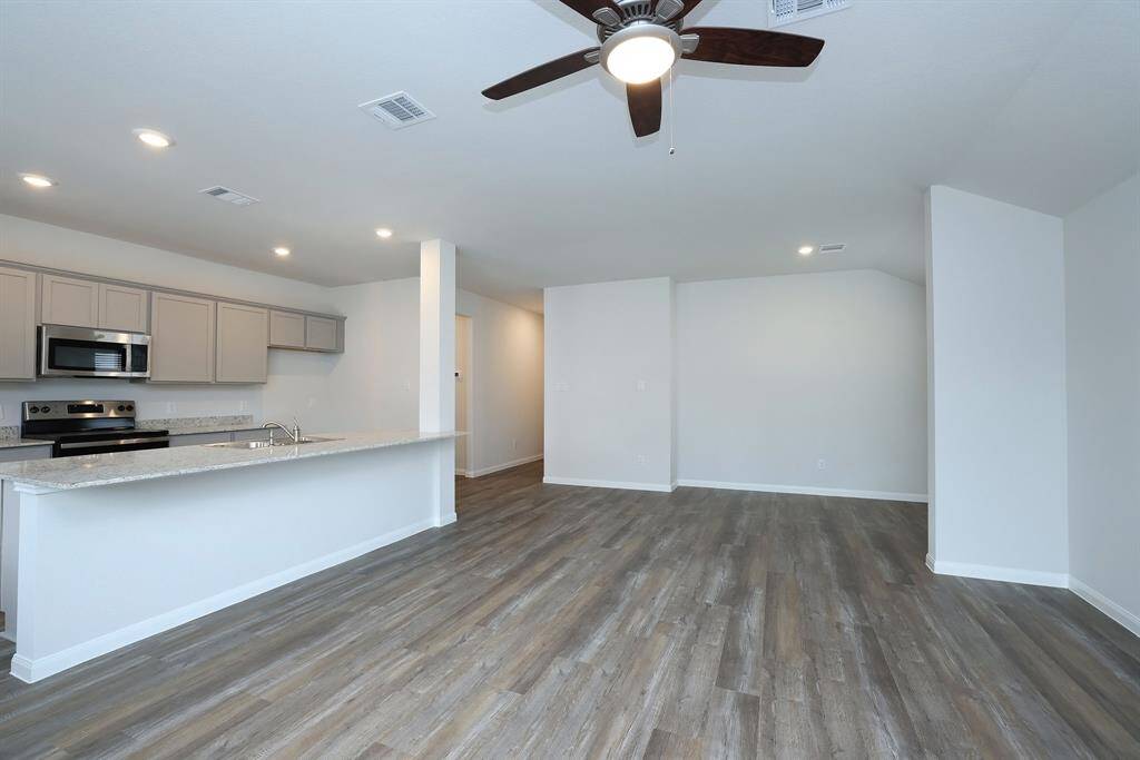 The gorgeous flooring maintains the rust yet modern look of Texas living.