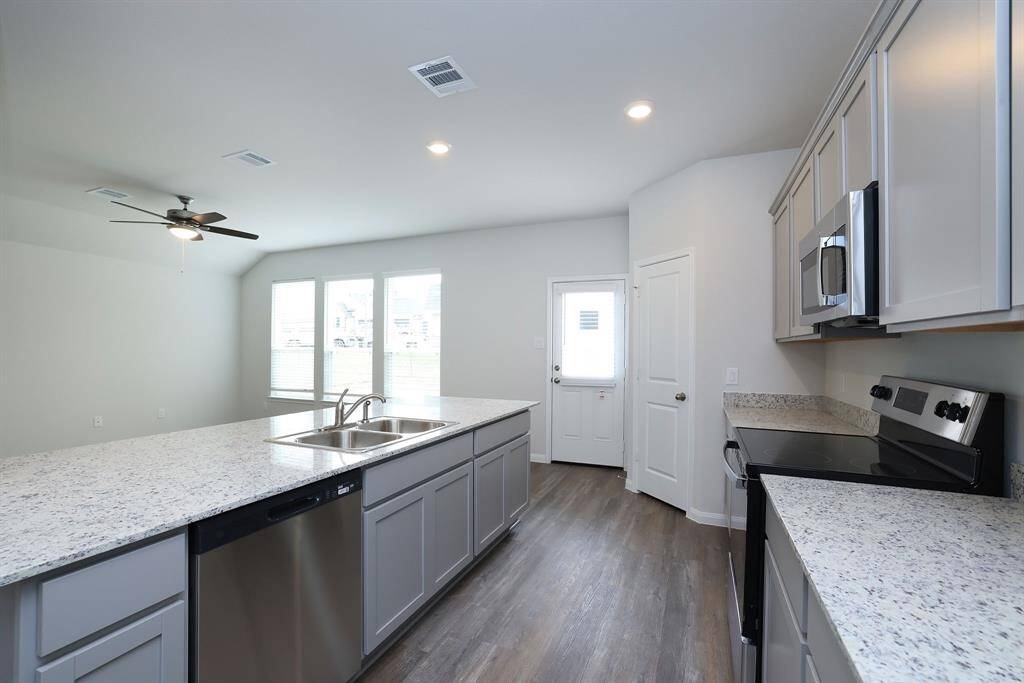 Never miss a piece of the action while you're in the Kitchen. The open concept floor plan keeps everyone connected.