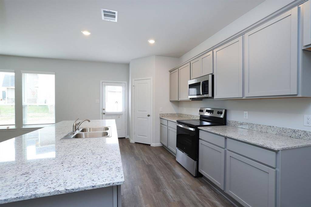 Stainless steel appliances provide a professional chef vibe in your new kitchen.