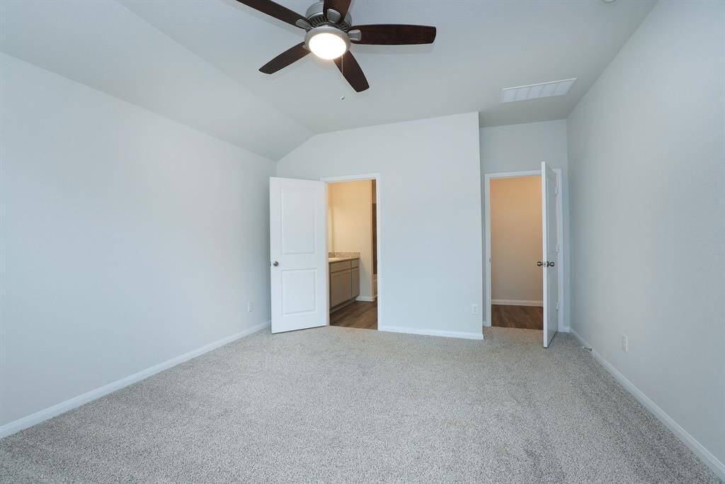 The en-suite bathroom and a walk-in closet are a dream. The neutral walls offer a fresh, clean look.