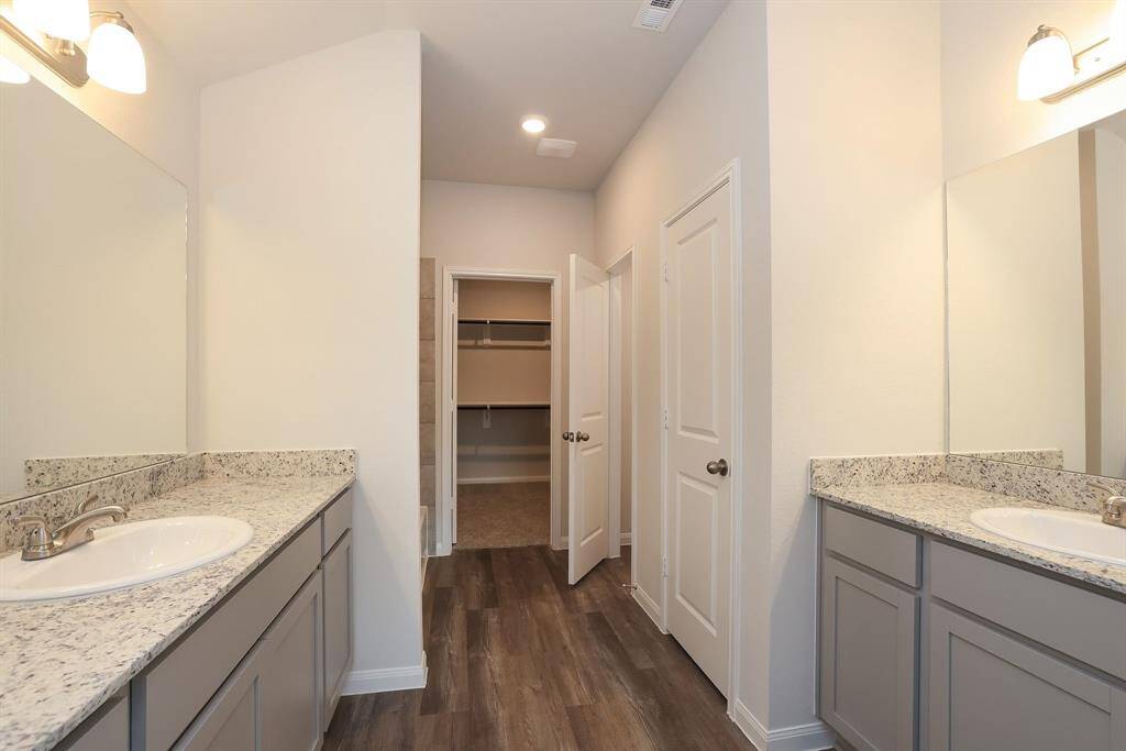 Separate vanities make getting ready for the day a breeze. And just wait until you see the closet ahead.