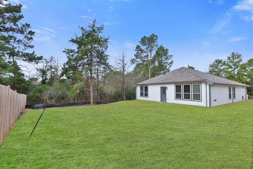 The white siding with gray trim of the house provides a charming style to the house.