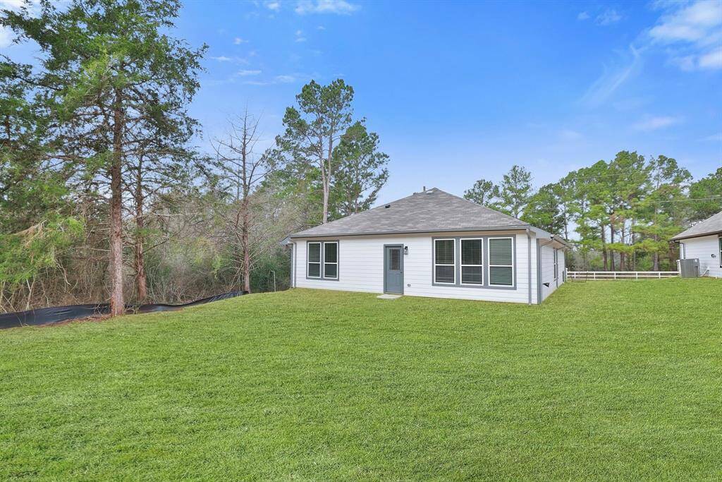 The property includes a newly sodded lawn with mature trees along the side and across the street, providing a serene and private setting. Call for your tour!