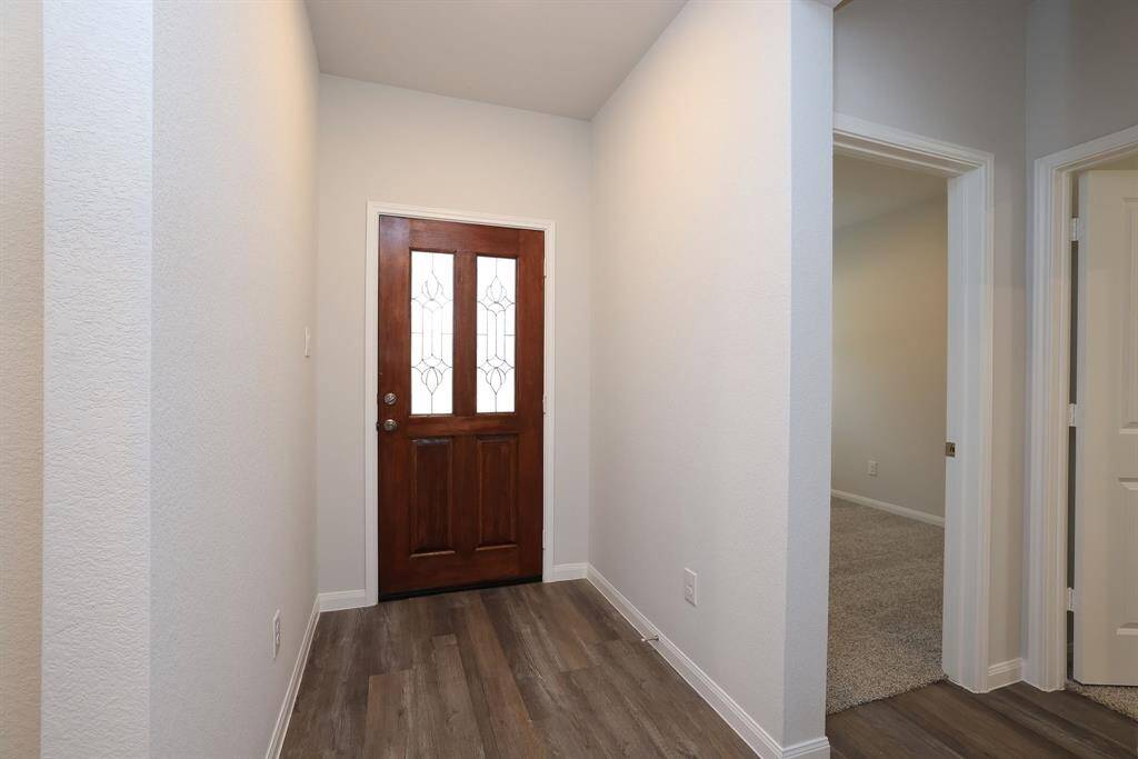 A formal Entry is an ideal place for an umbrella stand and petite table to hold your keys.