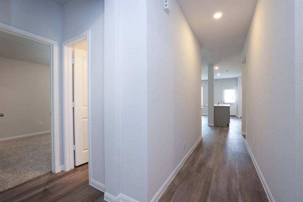 Once inside this floor plan guides you straight into the Kitchen and common areas while offering privacy to the front bedroom just to the left.