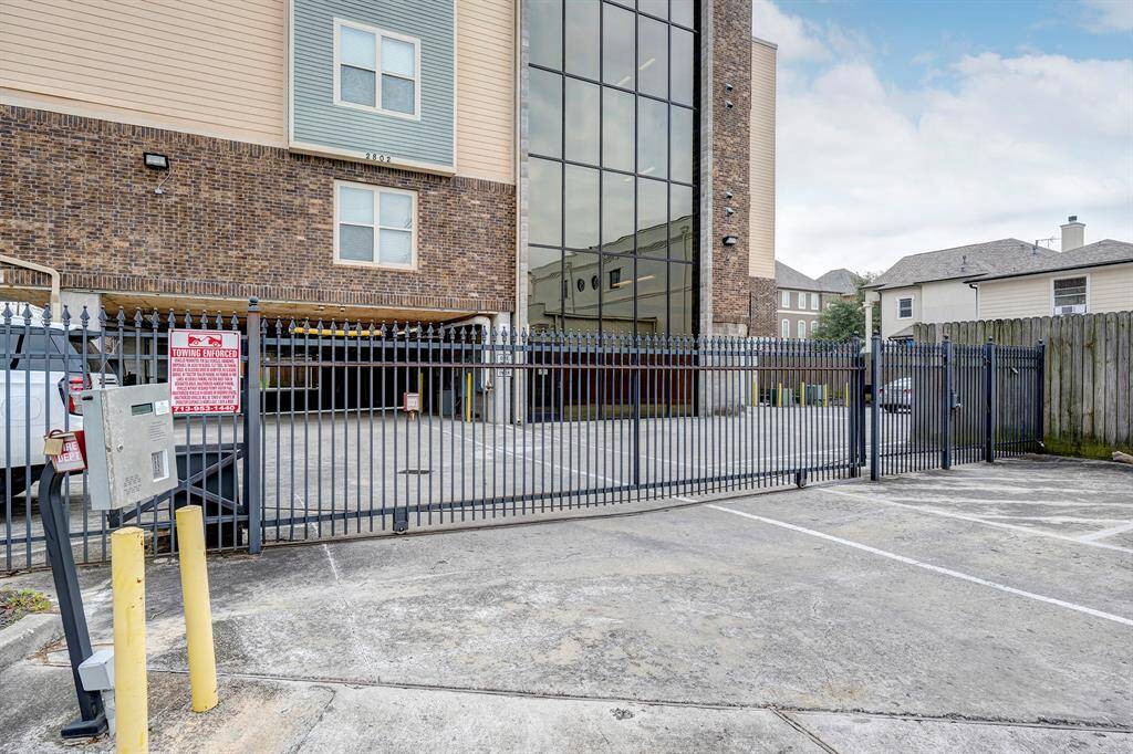 Exterior of the gate. Notice guest parking spaces to the right.