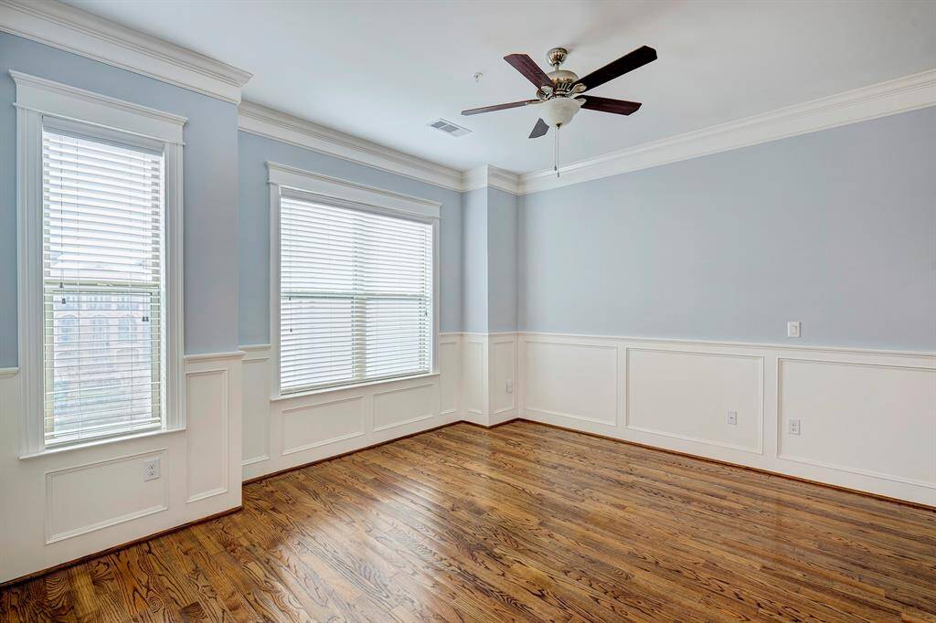 Sophistication with soothing blue gray walls and white wainscotting. Shown without furniture