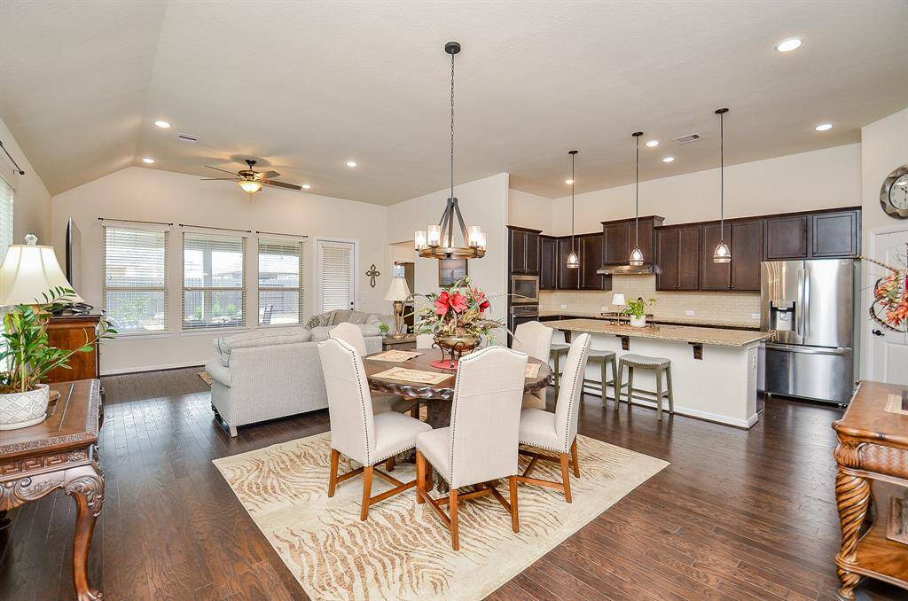 This beautifully designed residence boasts an open-concept floor plan that seamlessly unites the family room, dining room, and kitchen, offering a perfect blend of comfort and style. Gleaming wood floors, recessed lighting, and neutral paint tones enhance the home’s warm and inviting atmosphere.