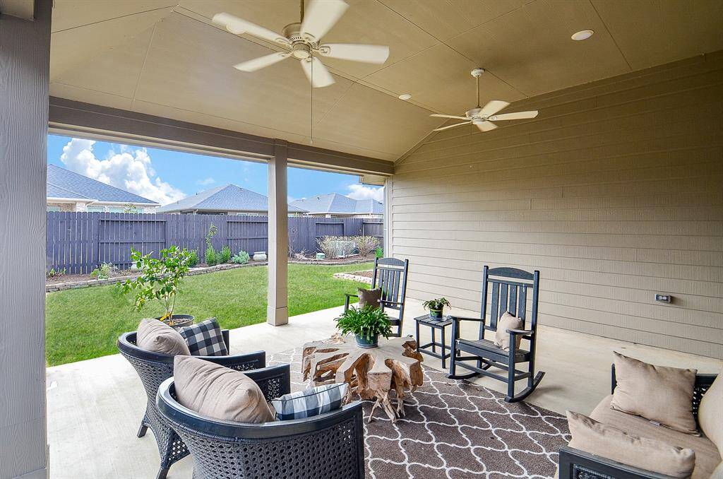 Step outside to a generous covered patio, a perfect spot to unwind or entertain guests.