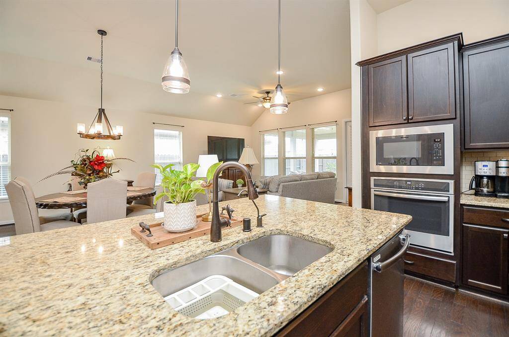 This dream kitchen is not only a chef’s delight but also a central hub for gatherings. Its open layout flows seamlessly into the adjacent dining room and family room, creating a cohesive space perfect for entertaining guests or enjoying everyday moments with loved ones.