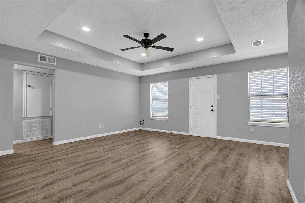 To your left is the hallway with two beds to your left and one bedroom to your right.