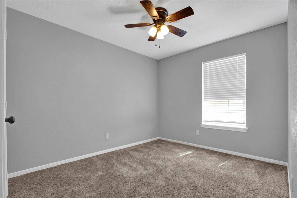 The primary bedroom is to the rear of the house.  Neutral colors throughout.
