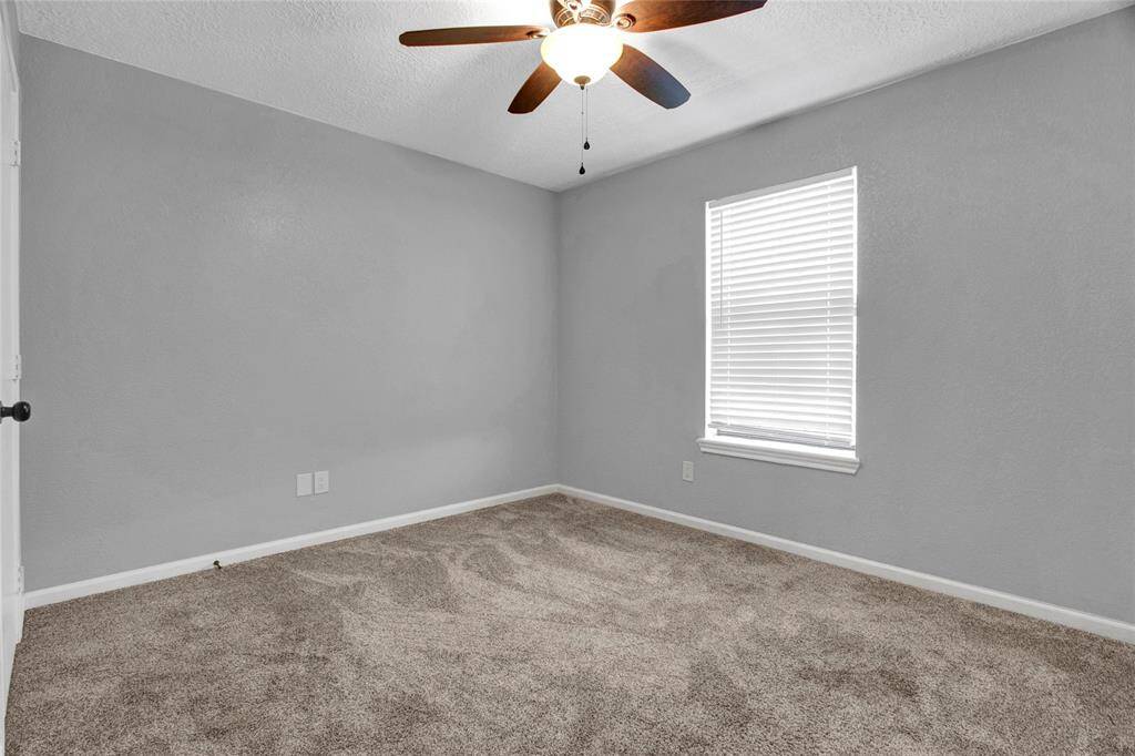 The second bedroom faces Rice Street and has a nice sized closet.